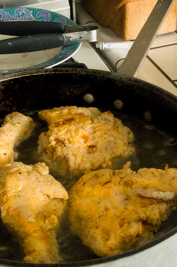 Hot oil crying crispy fried chicken to perfection