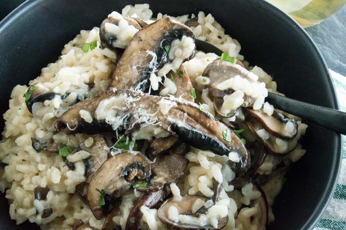 This Simple Parmesan Mushroom Risotto Recipe is a simple comfort food dish that will please everyone.  Just a few ingredients but packed full of earthy mushroom and tangy parmesan cheese flavors.