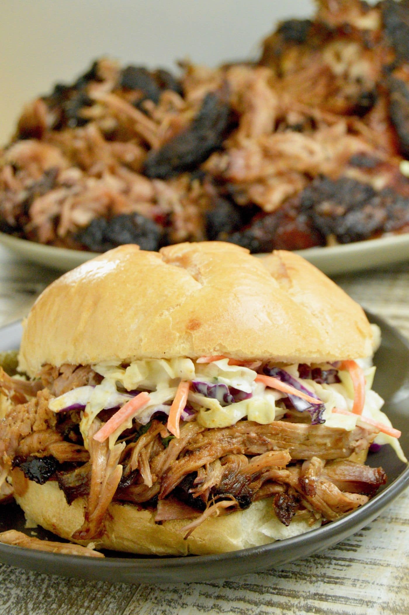 juicy pulled pork on a bun with coleslaw