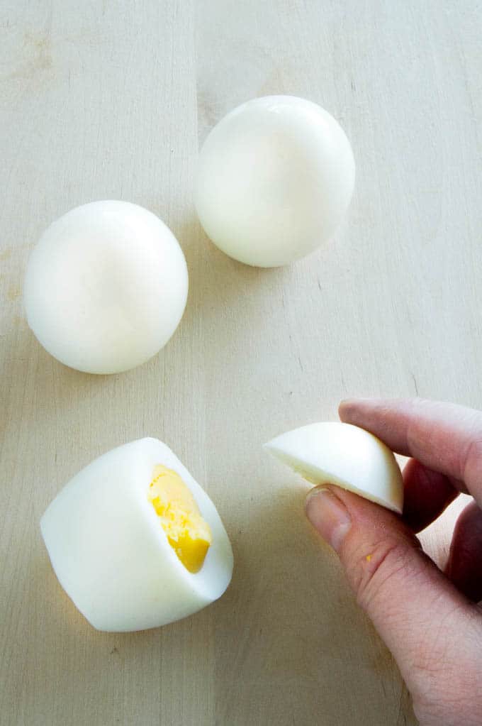 Cutting the deviled egg chick body