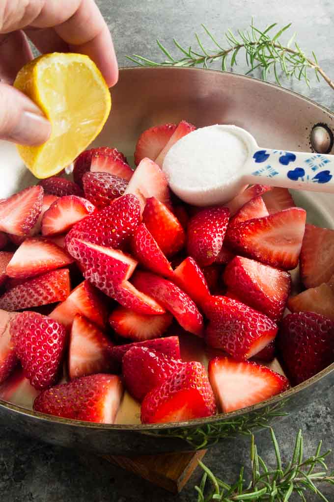 Fresh Strawberries , lemon juice and a bit of sugar in a pan to make jam