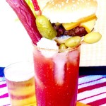 This Loaded Bloody Mary Cocktail is a full meal! Spicy Horseradish compliments the tangy tomato base and its topped with all the foods you want to eat when drinking a Bloody Mary, a burger, beef stick, olives, chunks of cheese and a Celery Stalk! Perfect for a brunch or watching a game!