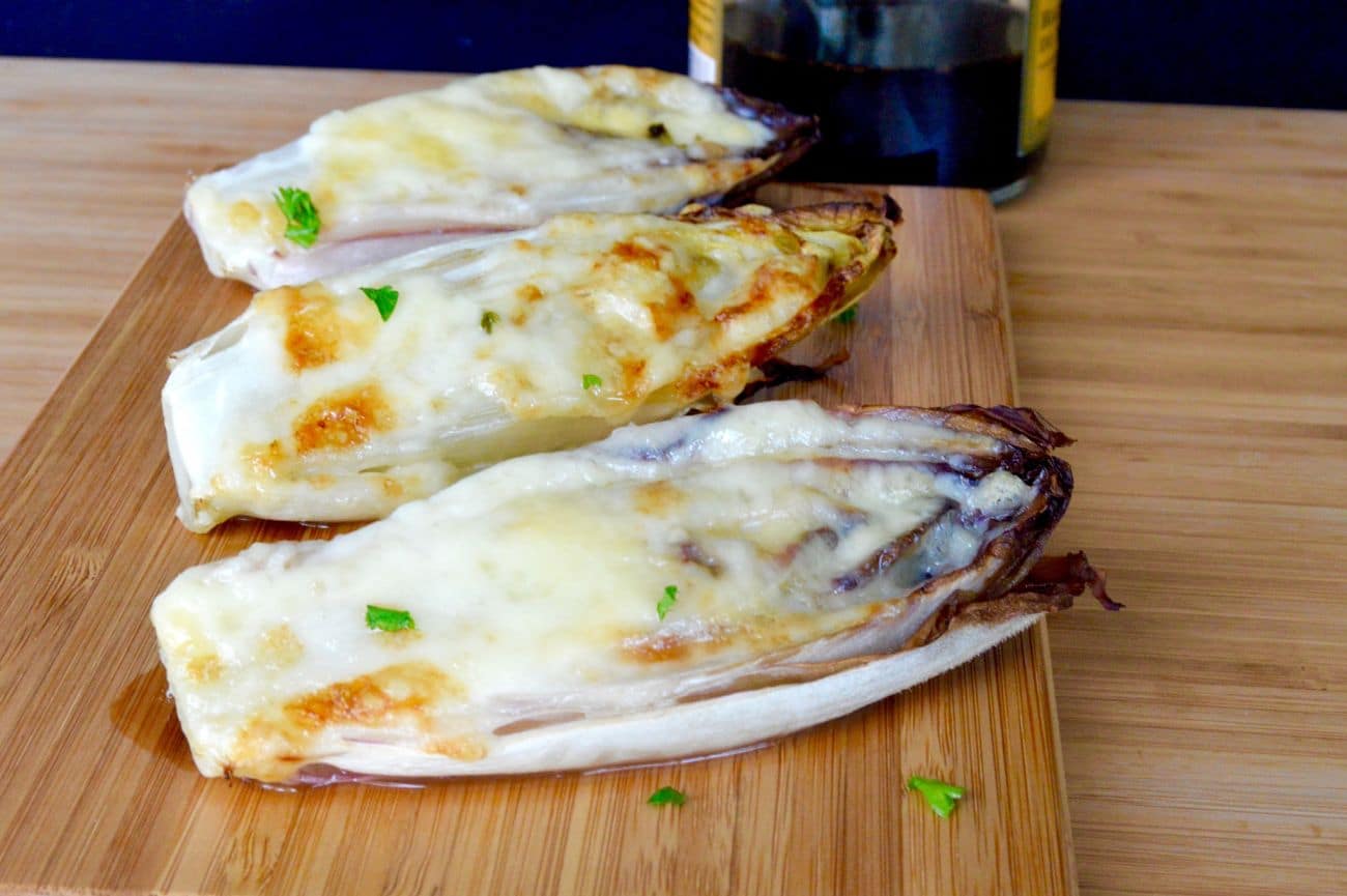 Cheesy Broiled Endive is an impressive, easy appetizer that only takes two ingredients! Topped with your favorite cheese it’s deliciously savory, filling and my favorite part…. Low carb!!!