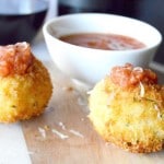 Gruyere Salami Risotto Balls (Arancini): An easy appetizer to make from leftover risotto. These Arancini balls are filled with a melty, stretchy Gruyere cheese and a spicy salami. Those are surrounded by risotto that is rolled in panko and fried for a crunchy bite of deliciousness!