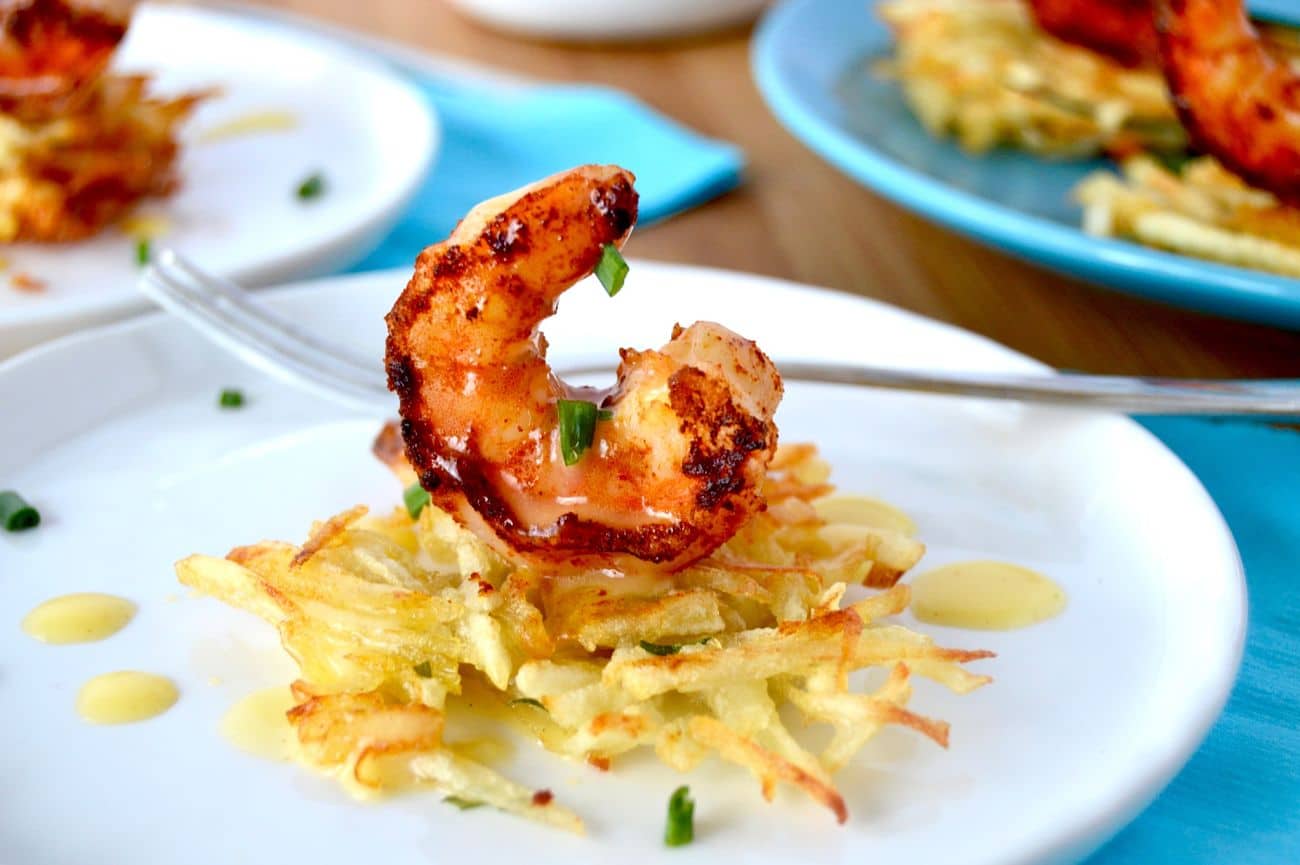Smoky succulent shrimp rolled in spices that caramelize placed over a crispy potato nest then drizzled in a buttery béarnaise sauce hit on all of your taste buds…. This recipe for Smoky Shrimp on potato nests is a fantastic appetizer that looks great and tastes even better.