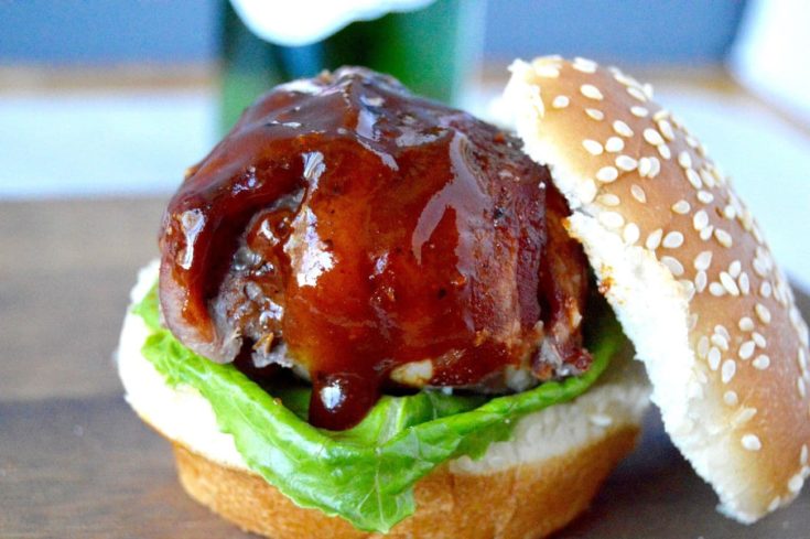 This BBQ Bacon Meatball Slider recipe is sure to he a hit! Juicy meatballs, wrapped in bacon brushed with BBQ sauce are the stars of this delicious slider!