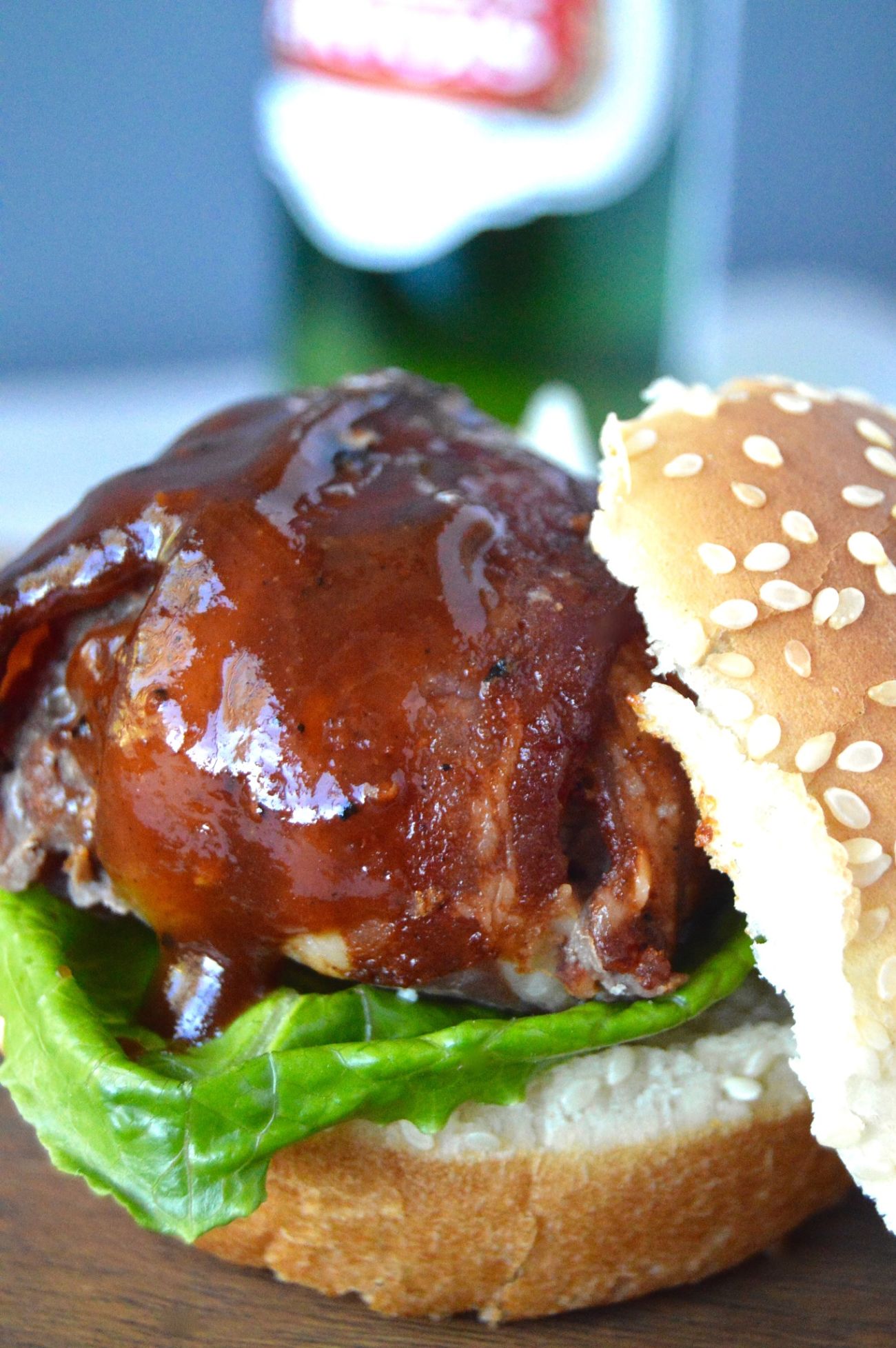 This BBQ Bacon Meatball Slider recipe is sure to be a hit! Juicy meatballs, wrapped in bacon brushed with BBQ sauce are the stars of this delicious slider!