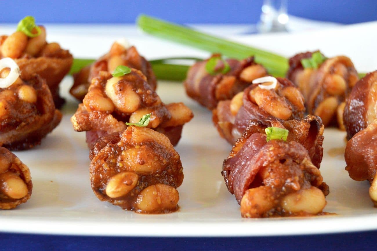 Baked Bean Bacon Cups are ideal for a big BBQ! Bite sized baked beans packed full of flavor served in individual servings of bacon cups! For those times you want to try everything, but don't want to be so full afterwards you can't move!