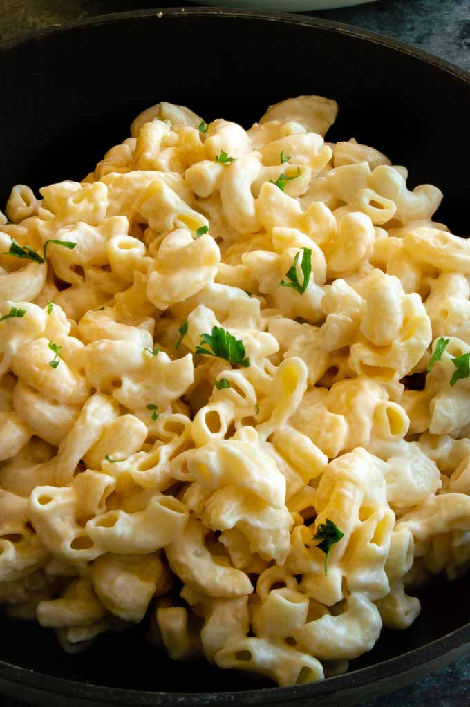 Homemade gouda mac n cheese recipe is creamy, extra velvety and swirls perfectly around al dente pasta with extra cheese sauce in each crevice for pure deliciousness in each forkful.