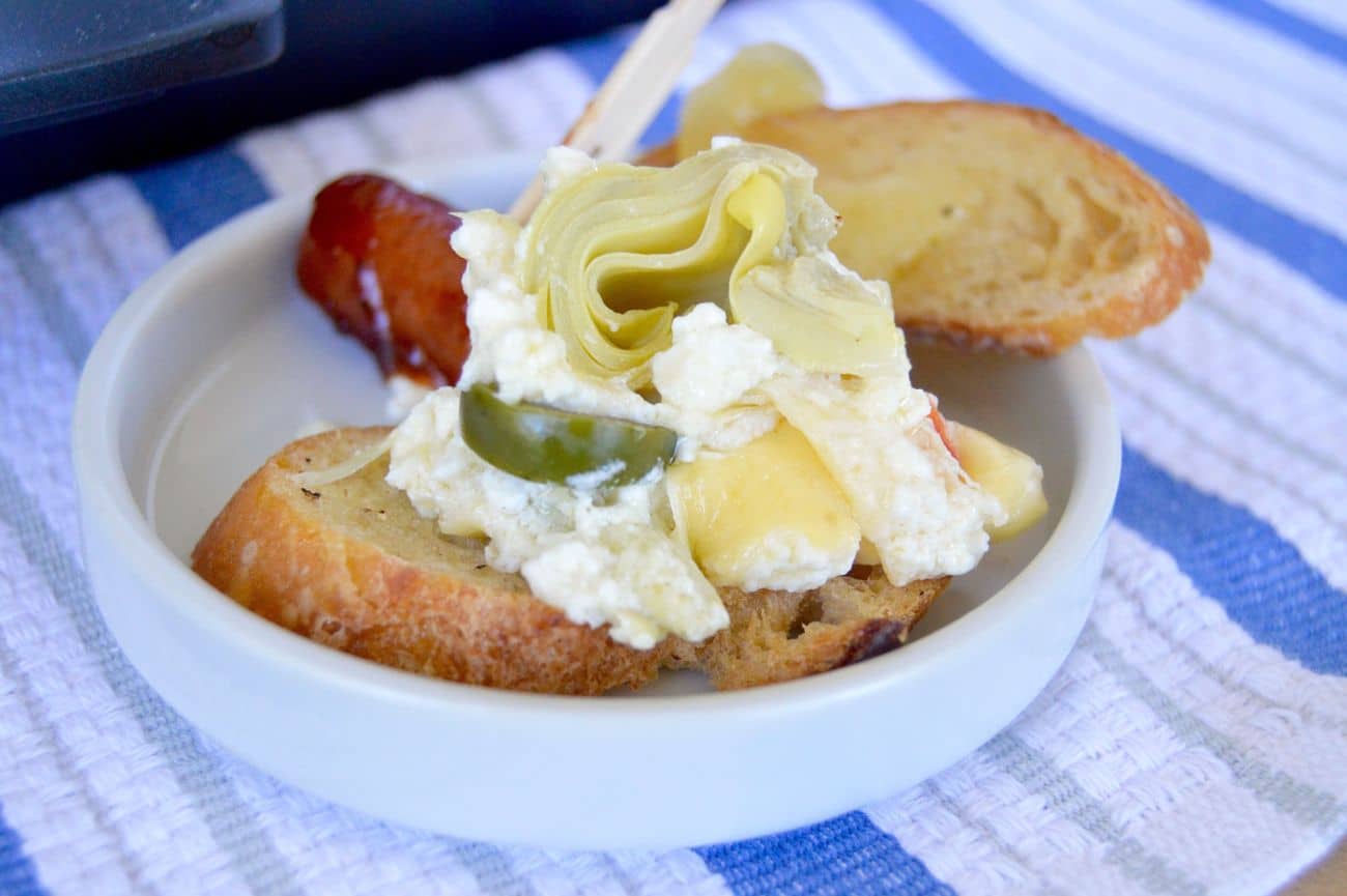 Artichoke Feta Dip: Creamy, tangy, super spreadable and perfect to mix up quickly! A perfect dip for any occasion.