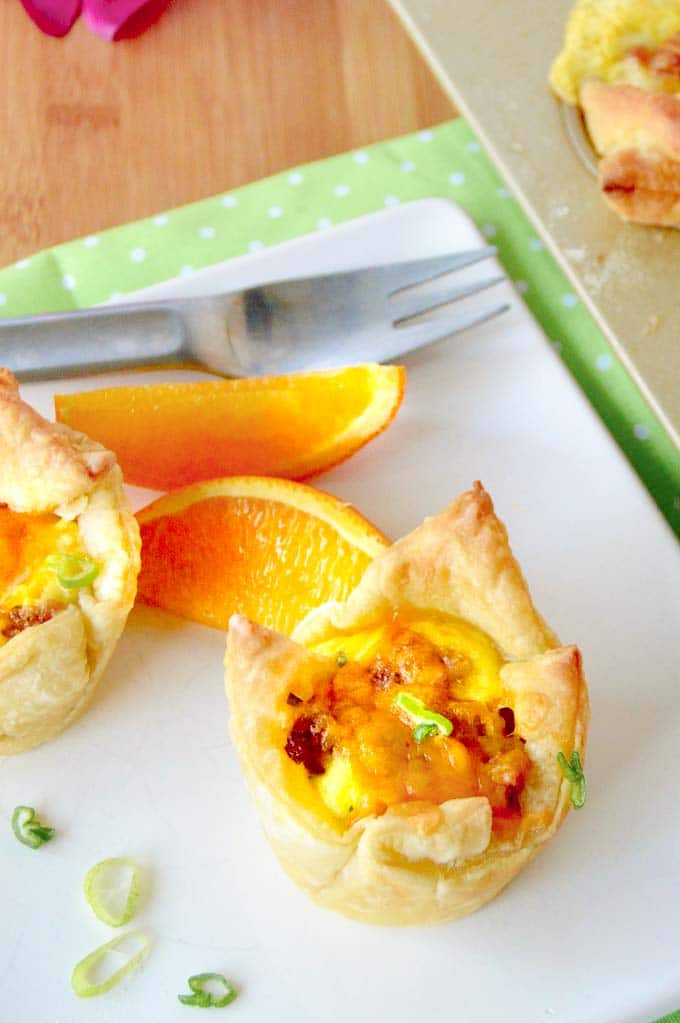 breakfast cup on a white plate with oranges