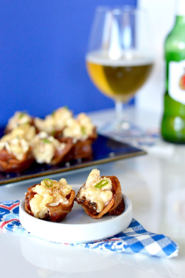 Show stopping bites that your guests will love! These Bacon Mac n Cheese Cups are perfect to make for the big game! Each bite full of creamy mac n cheese but served in a crispy, salty bacon cup!