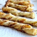 You need a fast and easy peasy appetizer that everyone will love. These Maple Bacon Cheese Twists are just what you are looking for! The sweet sticky maple syrup coats the crispy salty bacon all encased in flaky puff pastry and your guests will love them