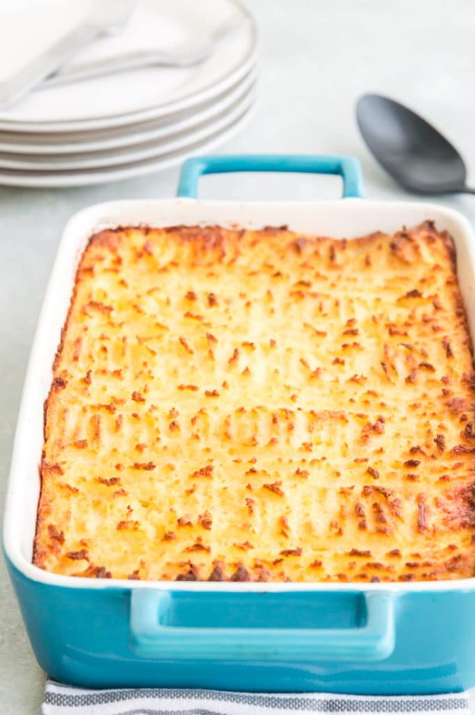 Tray of cottage pie with crispy crust of mashed potatoes on it