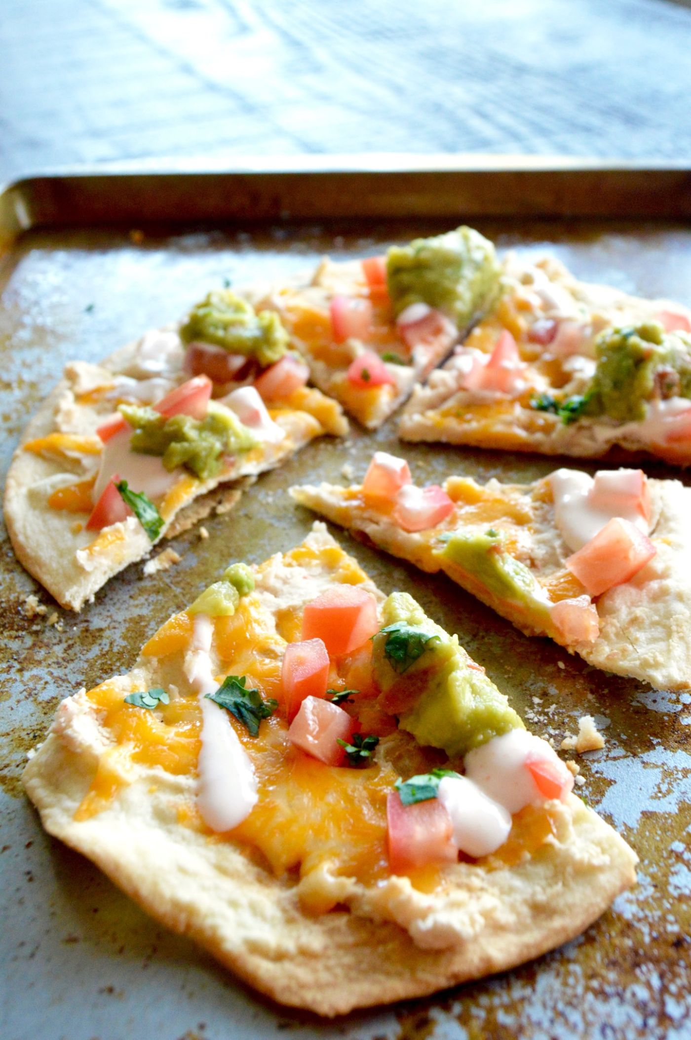 Healthy Tortilla White Bean Pizza cut on a tray ready for immediate serving!