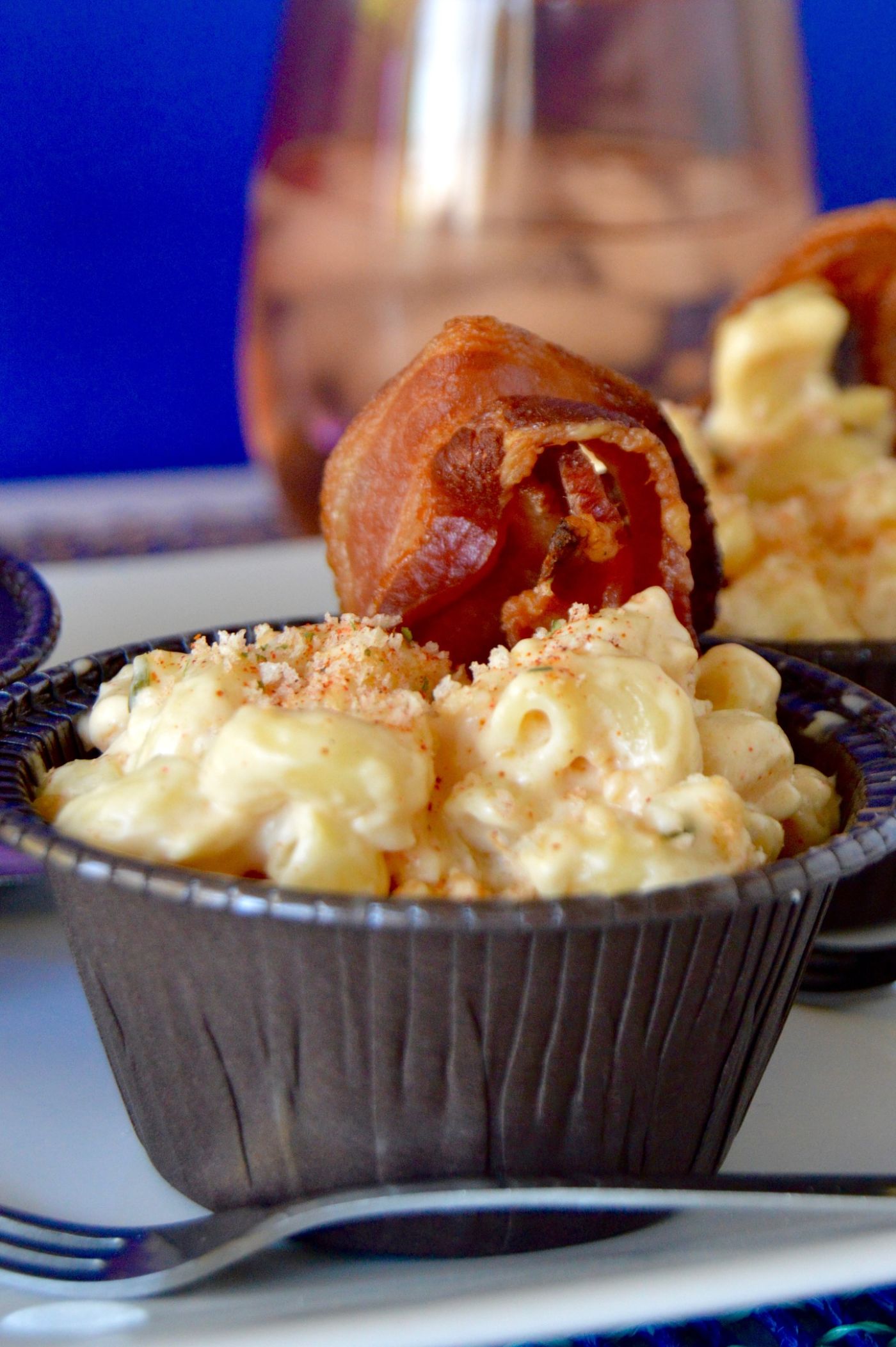 Individual serving cups for Gouda Mac n Cheese topped off with a bacon strip!