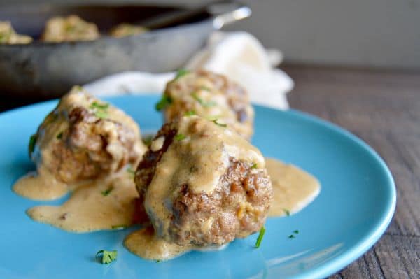 Authentic Swedish Meatballs (IKEA copycat) can be ready to serve in 30 minutes which makes them perfect for last minute meals! Served in a creamy gravy and you only need pantry ingredients and ground beef to make them!