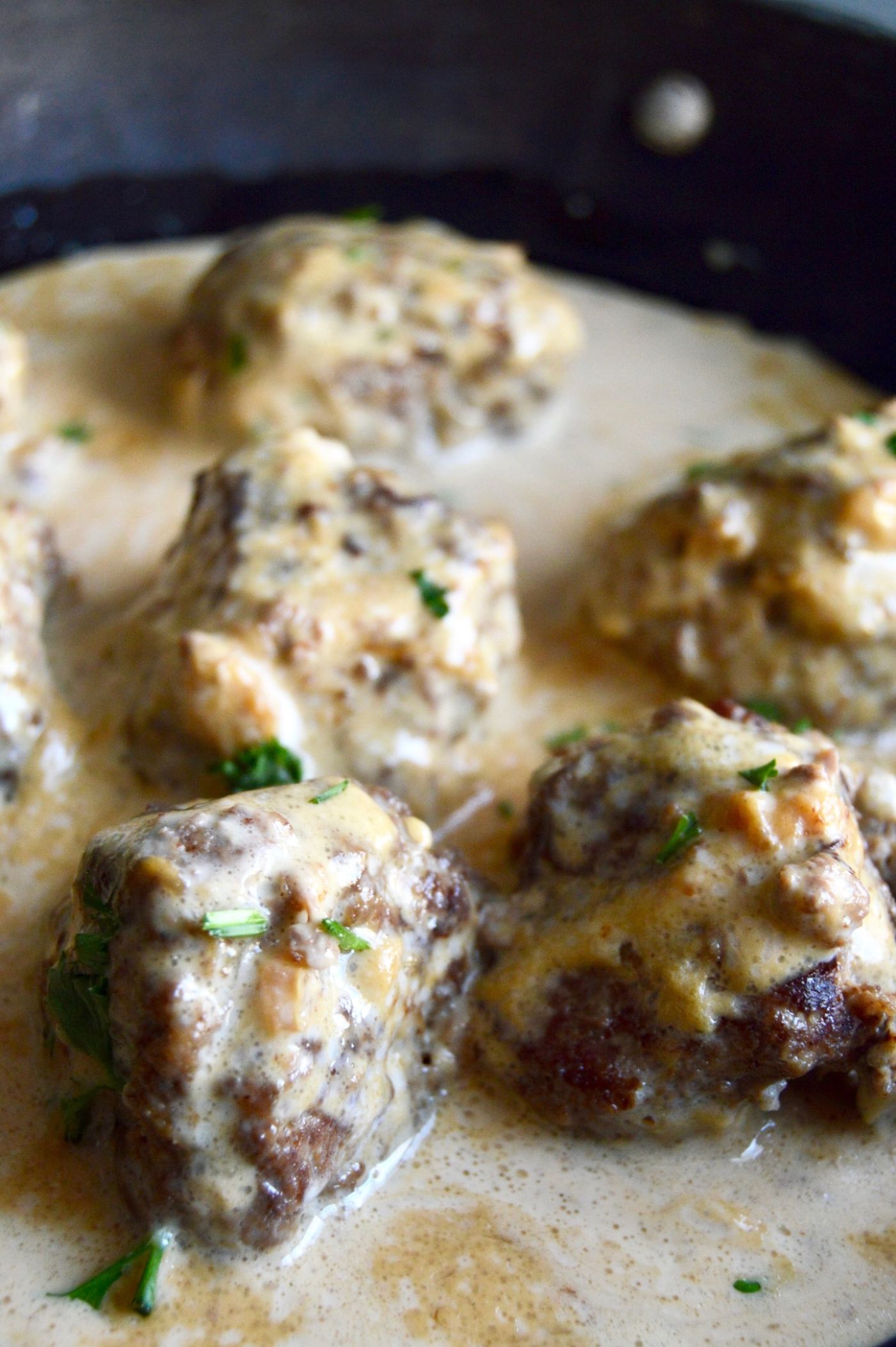 Authentic Swedish Meatballs (IKEA copycat) can be ready to serve in 30 minutes which makes them perfect for last minute meals! Served in a creamy gravy and you only need pantry ingredients and ground beef to make them! 