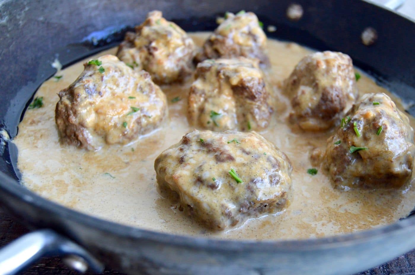 Authentic Swedish Meatballs (IKEA copycat) can be ready to serve in 30 minutes which makes them perfect for last minute meals! Served in a creamy gravy and you only need pantry ingredients and ground beef to make them!