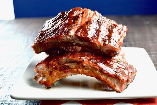 Grilled low and slow yields fall off the bone tender BBQ ribs, brush with a tangy bbq sauce for lip smacking deliciousness. Perfect for summertime entertaining!