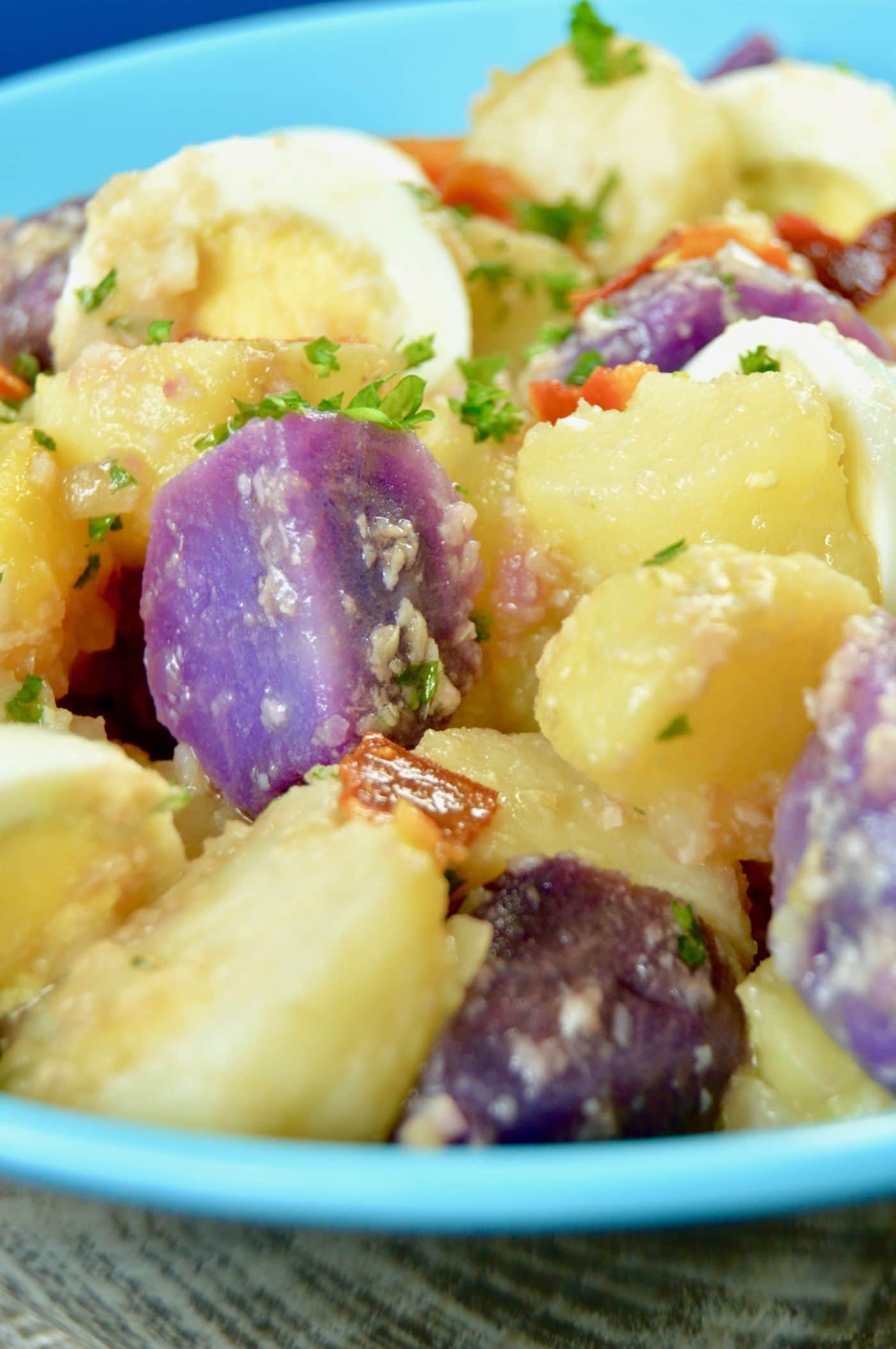 With three kinds of tender potatoes, this Creamy Mayo Free German Potato Salad is loaded with parmesan cheese and bacon. Perfect for a grilled dinner, summertime meal or to bring to a picnic.