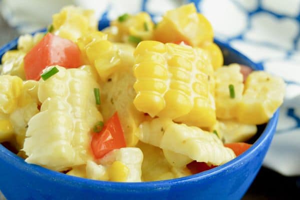 Fresh Chili Lime Sweet Corn Salad is THE ideal BBQ side dish to bring for any party this summer! Sweet, succulent corn, fresh juicy tomatoes blended with a cold chili lime dressing.