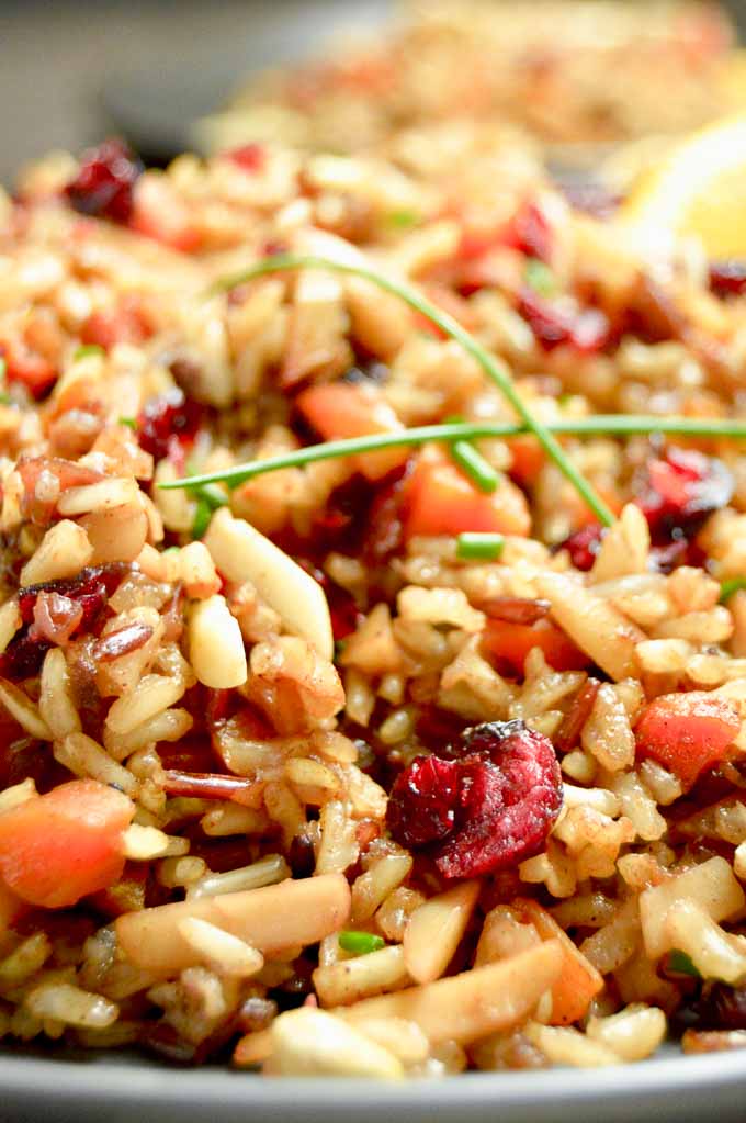 close up of moist, moroccan rice pilaf with carrots, almonds and cranberries