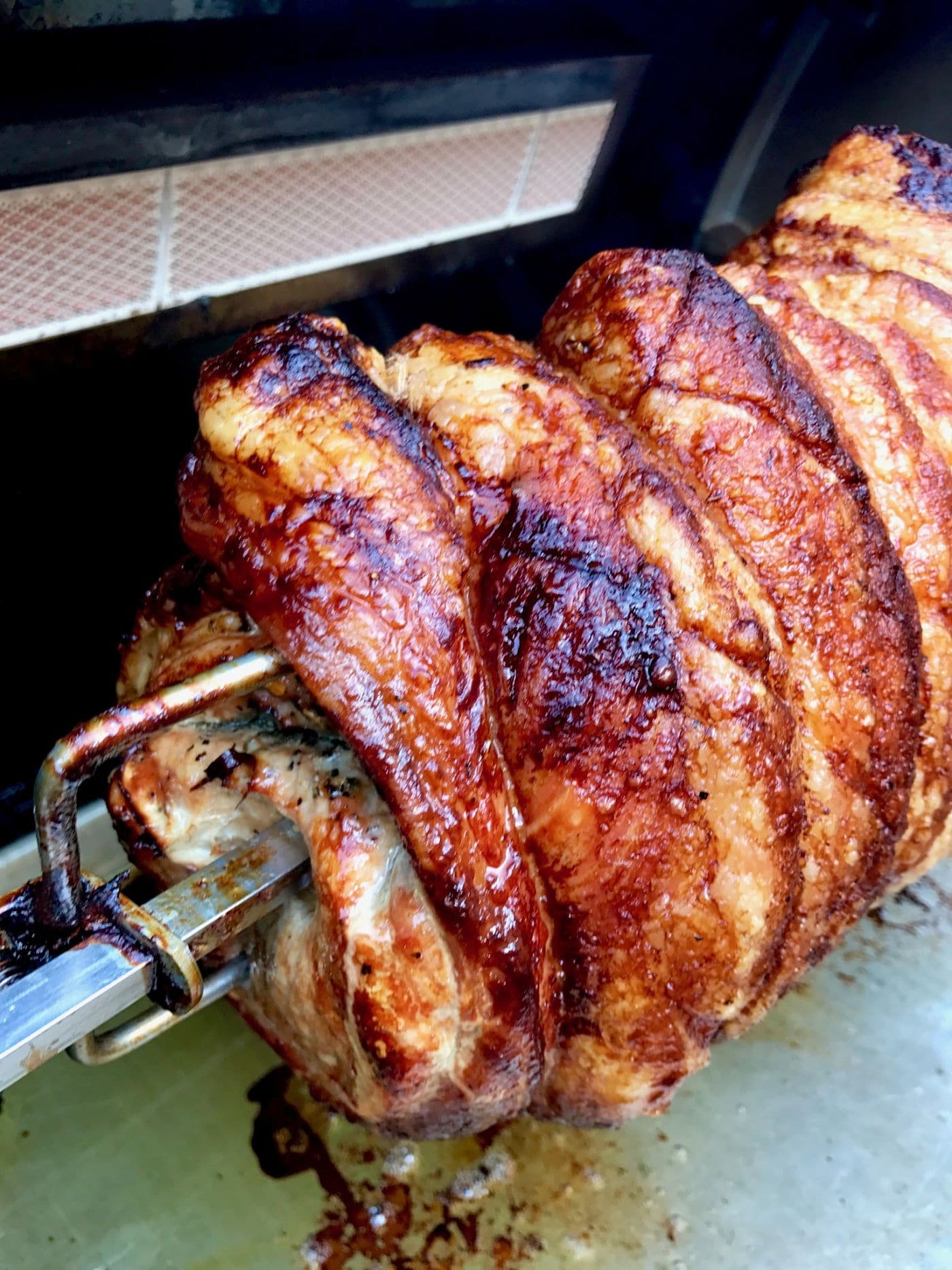 On the Rotisserie --Porchetta, Crispy Pork Belly with herbs wrapped around a pork tenderloin and cooked to juicy, tender perfection.  A crazy impressive meal to your guests, but you'll know how simple it was to make!