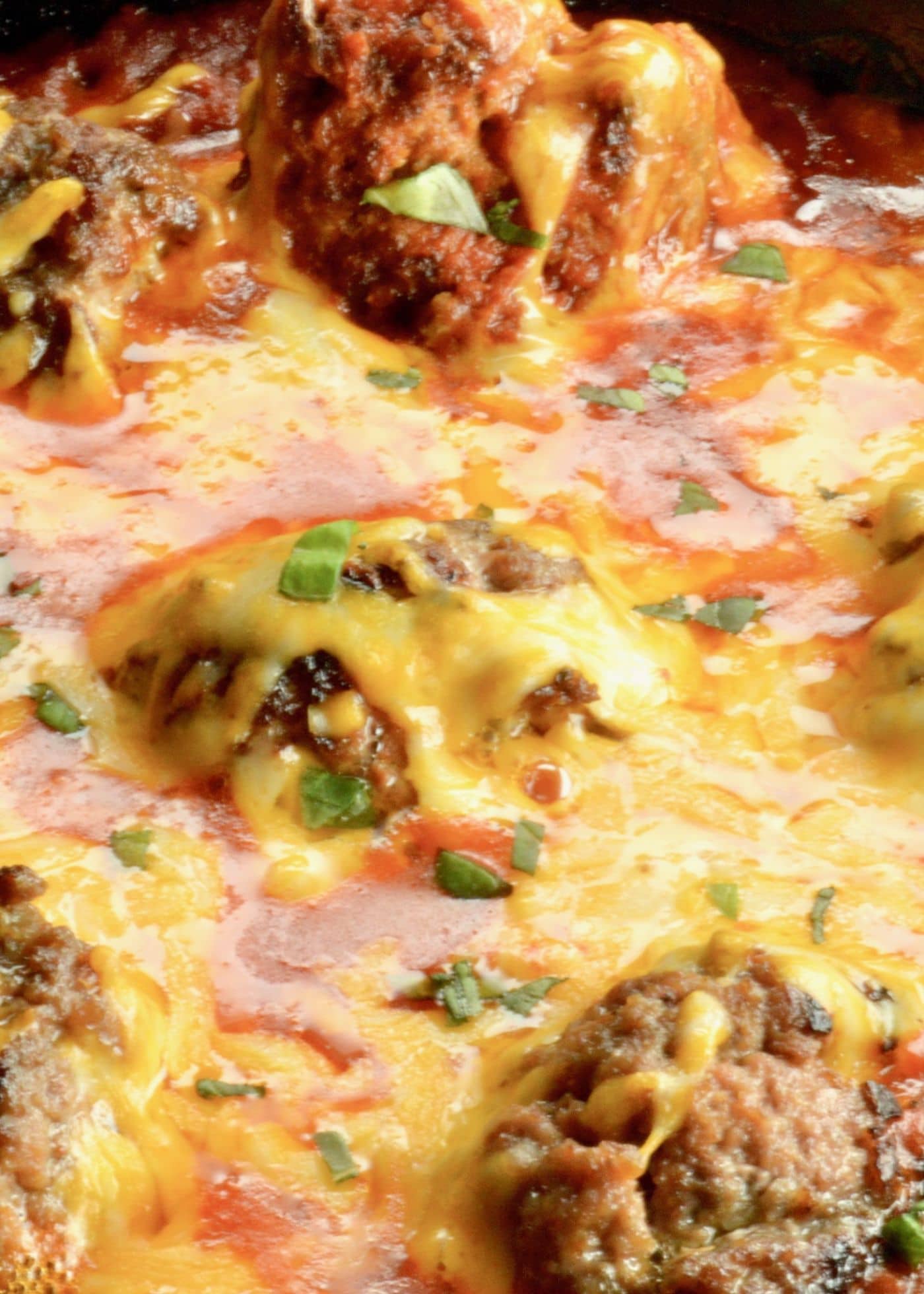 Cheesy Meatball Skillet dip is a quick appetizer that your guests will love.  Tender meatballs, with a light tomato sauce with lots of melty cheeses for complete comfort food.