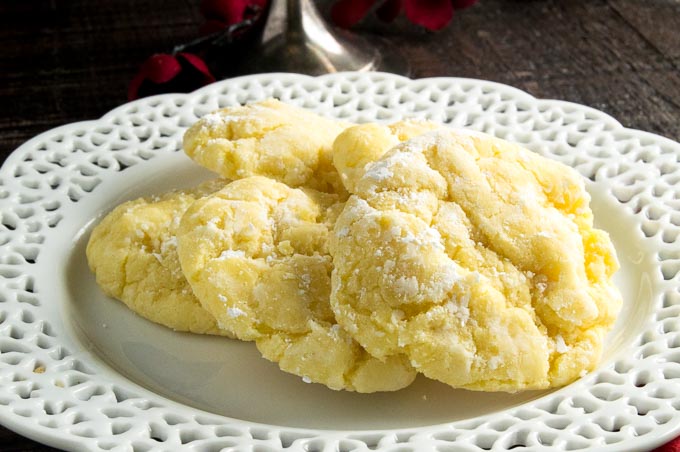 Gooey Lemon Butter cookies are the crinkle cookies you love to get at Christmas in food gifts, gooey, tart lemon centers that have a light powdered sugar! Made quick and easy that come out perfect every time!
