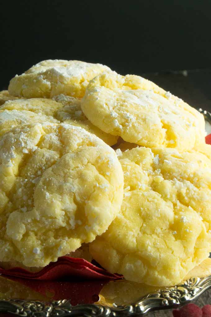 lemon Gooey butter cookies on a silver stand being displayed on a table.