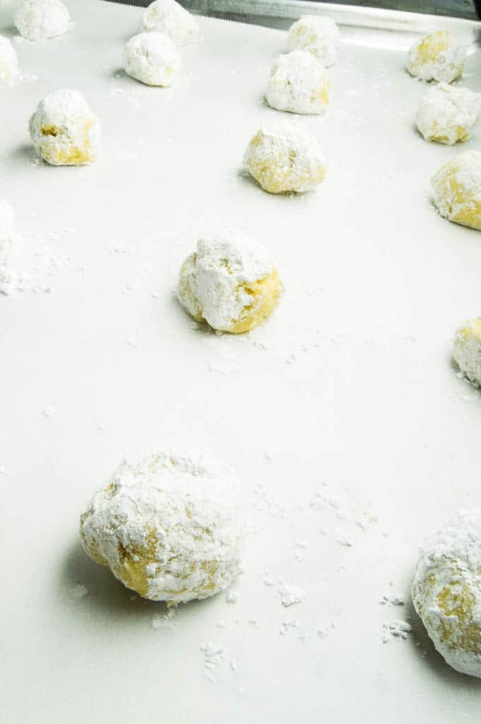 Lemon Gooey Butter Cookies all spaced on a tray ready to go into the oven.