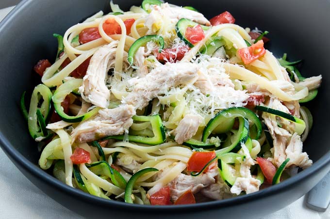 Bruschetta Chicken Zucchini Spaghetti has the pasta you are craving but lightened up with zucchini noodles.  Flavored with fresh tomatoes and roasted chicken that fits the healthy comfort food you are craving!