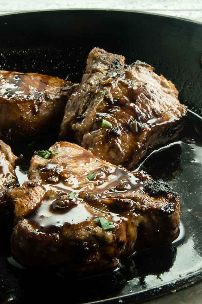 Pan Seared Lamb chops in the cast iron pan ready to serve.