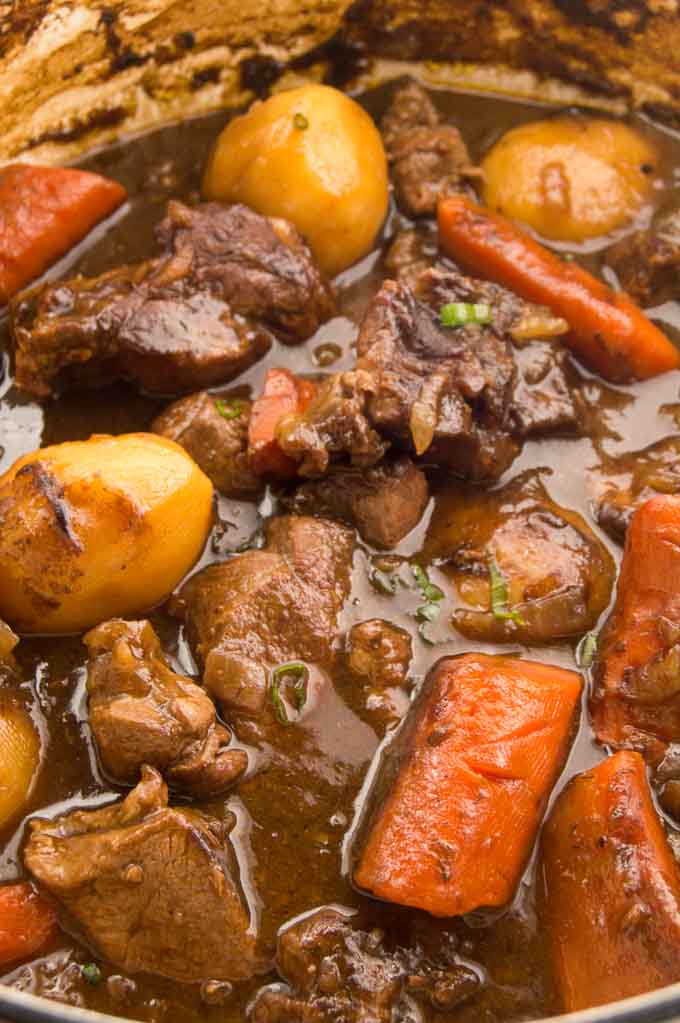 Close up of chunky vegetables in lamb stew.