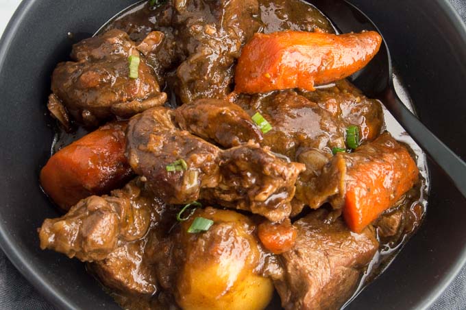 This Irish Lamb Stew recipe is made by slow cooking the lamb in a deep rich velvety broth. Mixed with rustic chunks of carrots and whole potatoes make this one pot meal a complete comfort food!