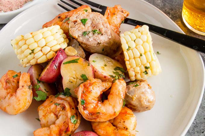 This Cajun Grilled Shrimp Foil Packet can be made ahead ready to grill when you're ready to eat.  Easily customizable, full of delicious cajun/creole flavors.