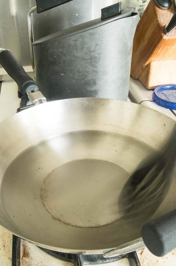 Swirling the water in wok pan just before adding egg