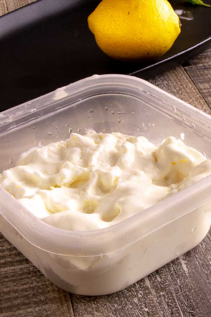 Fresh Lemon ice cream stored in a container for the freezer.