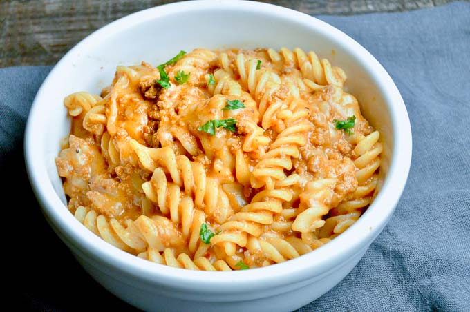 Cheesy Taco Goulash Pasta is a twist on a family staple. Cheesy, Spicy, warm comfort food with pantry staples that you can make last minute for spur of the moment entertaining!