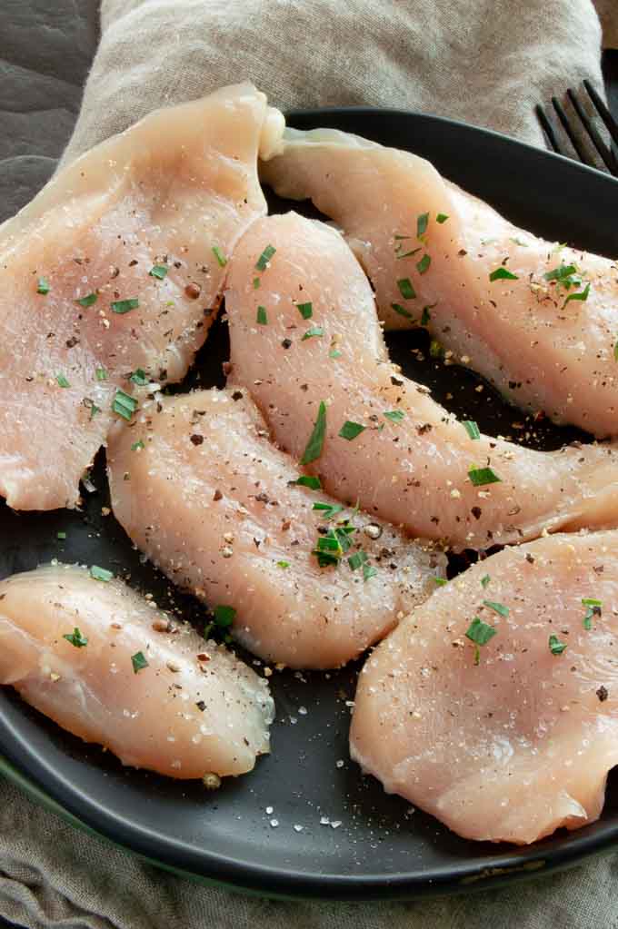 Seasoned chicken pieces just before cooking on the stove-top