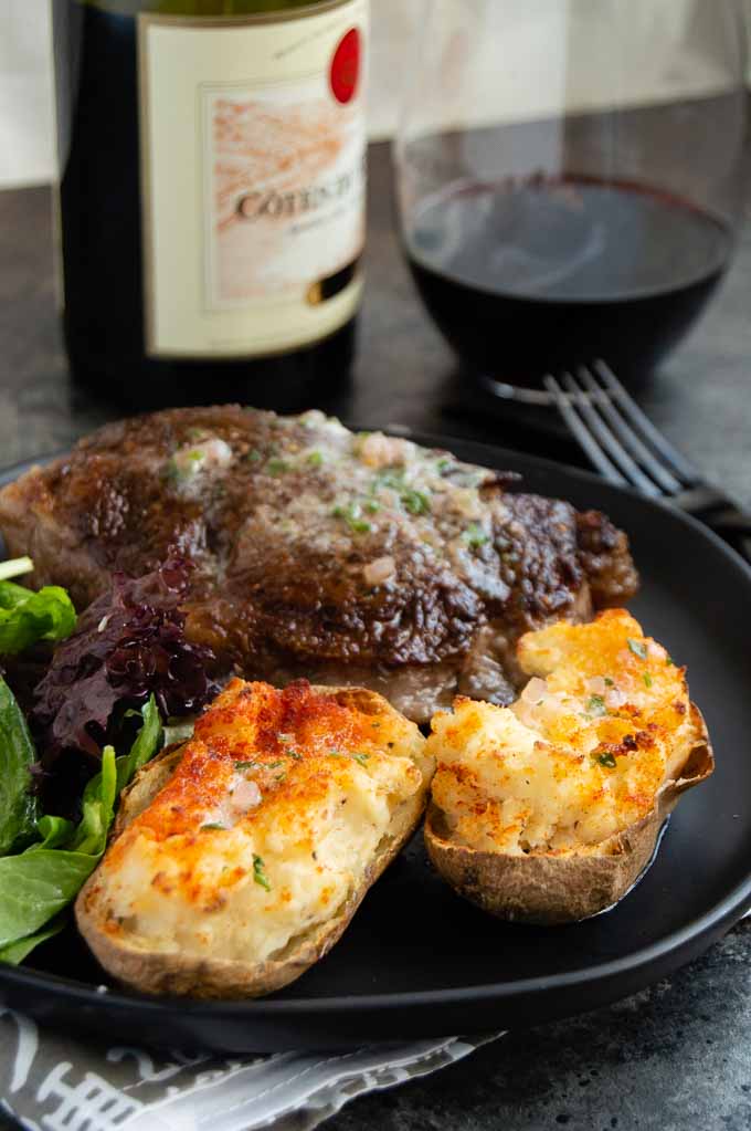 Crunchy jacket double baked potatoes on a plate for a fancy meal.