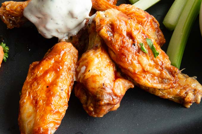 crispy Airfryer wings on a plate with dipping sauce