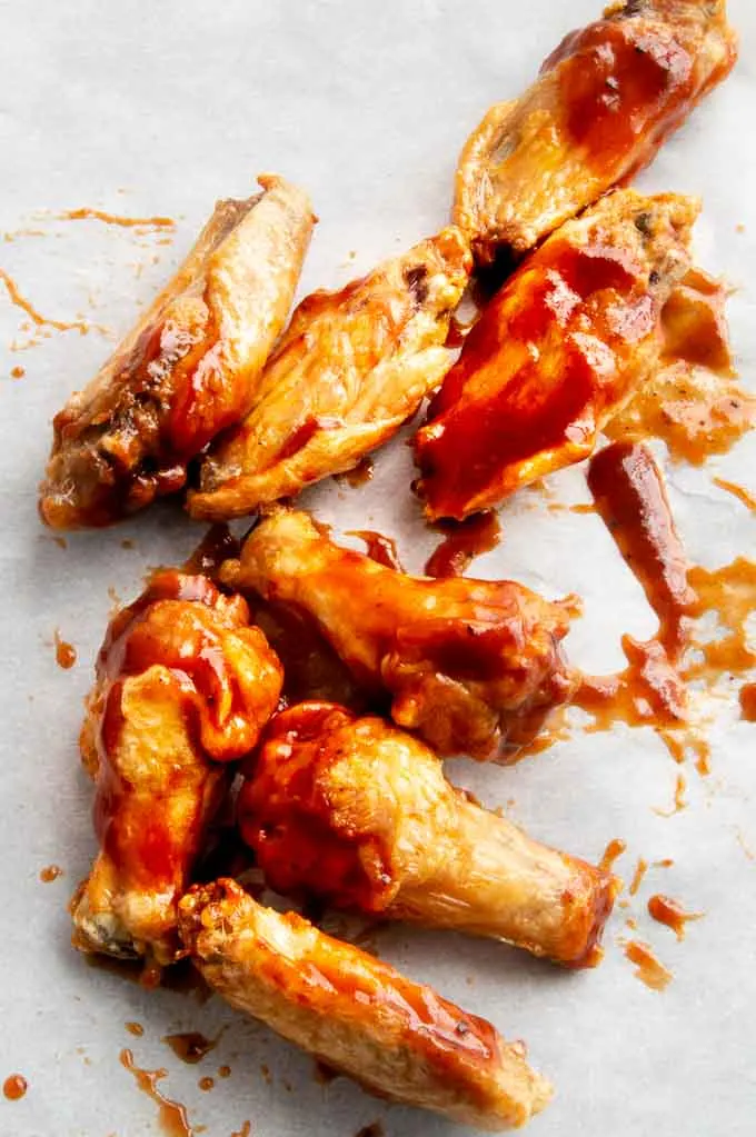 Tossing Airfryer wings onto parchment paper