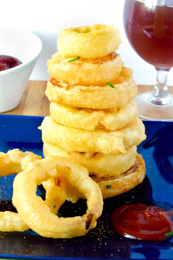 tower onion rings next to a cocktail