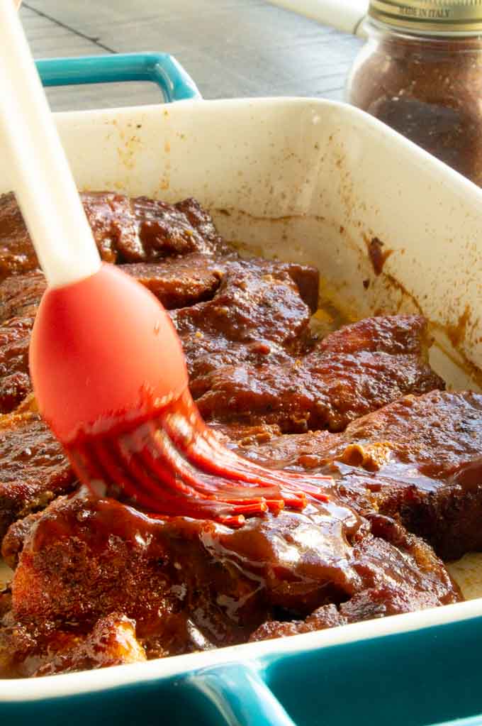 basting the boneless country style ribs with bbq sauce