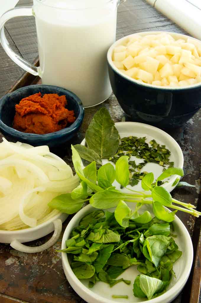 Ingredient for thai shrimp curry thai basil, onion, potatoes, curry paste, coconut cream