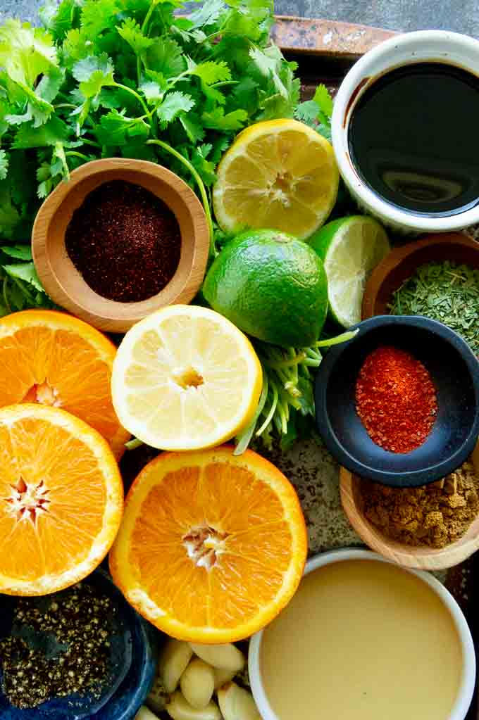 tray of fruits, spices, and herbs for Carne Asada marinade