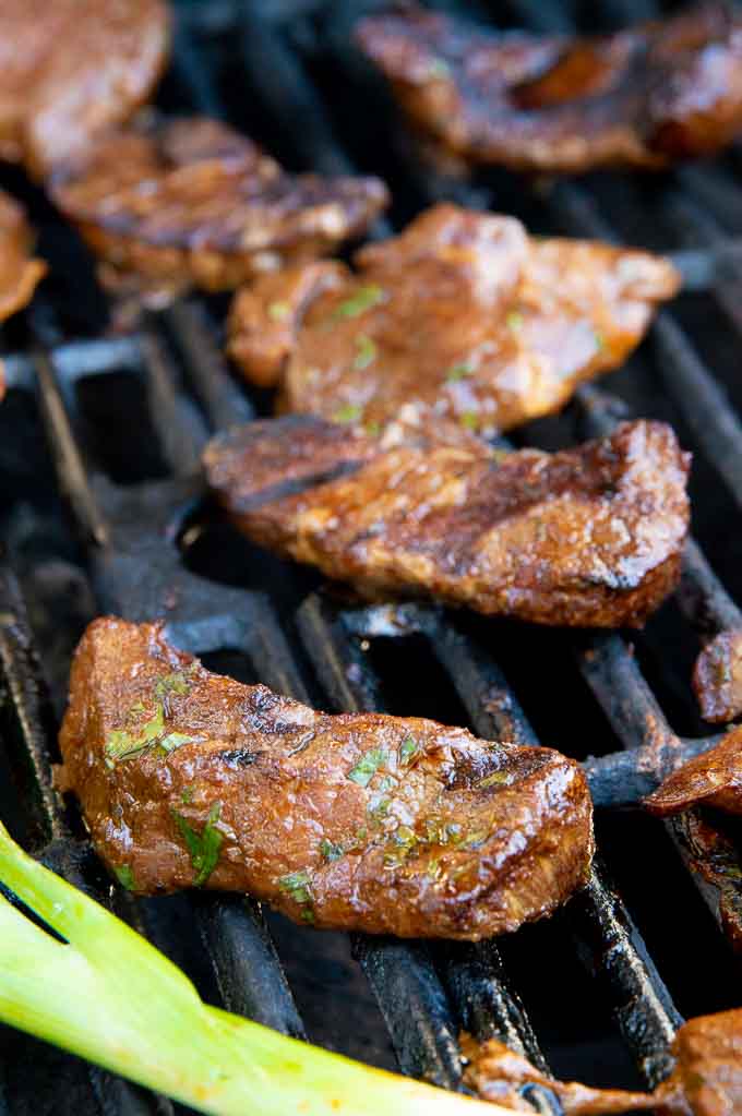 grilled pieces with charred marks on the Asada/steak