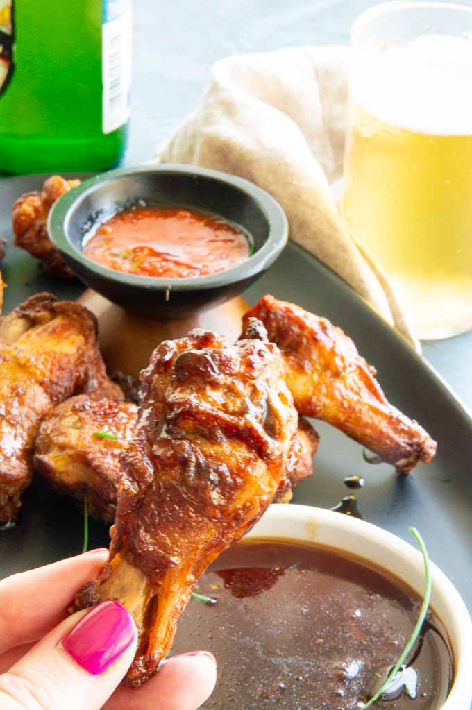 Dipping Airfryer Chicken wings into Korean Dipping sauce